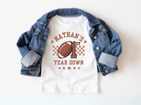 Personalized 1st Year Down Birthday Shirt – Football & Checkered Design